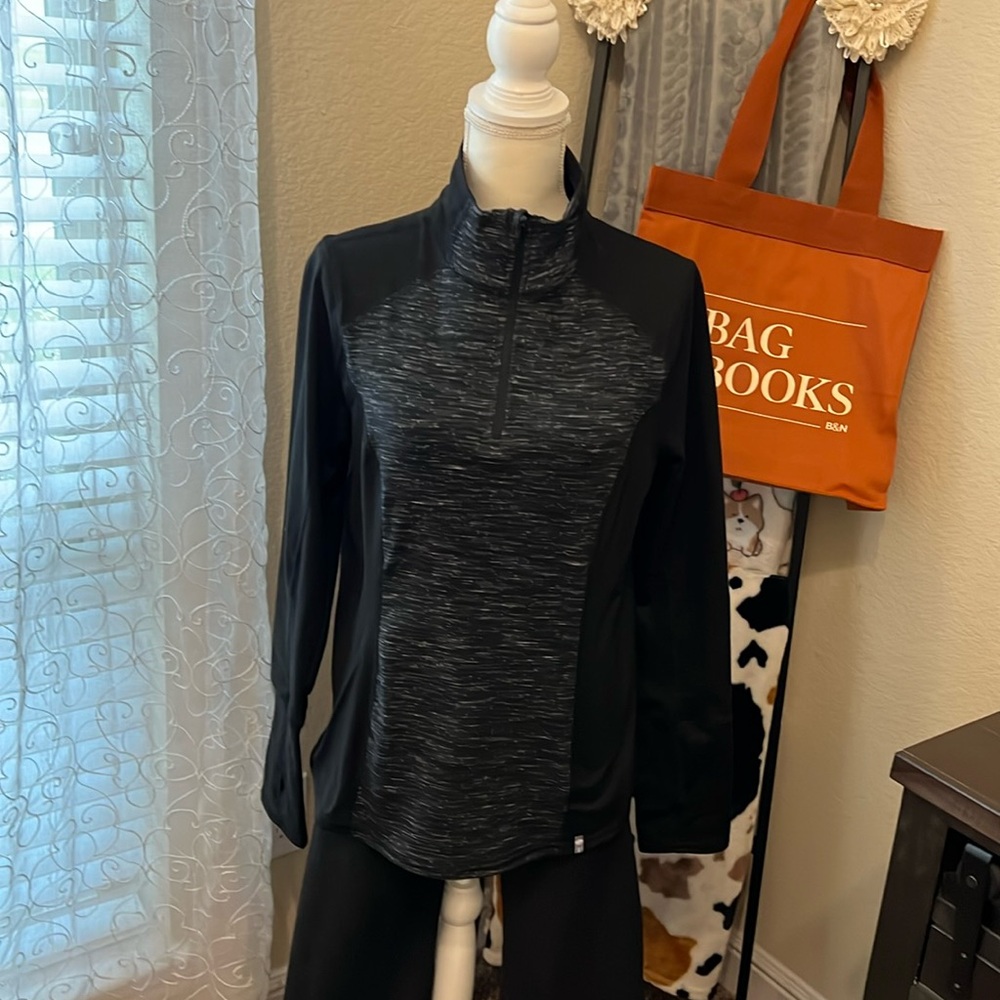Very lightweight fleece 1/4 pullover. Black sleeve& sides. Black Heather front.
